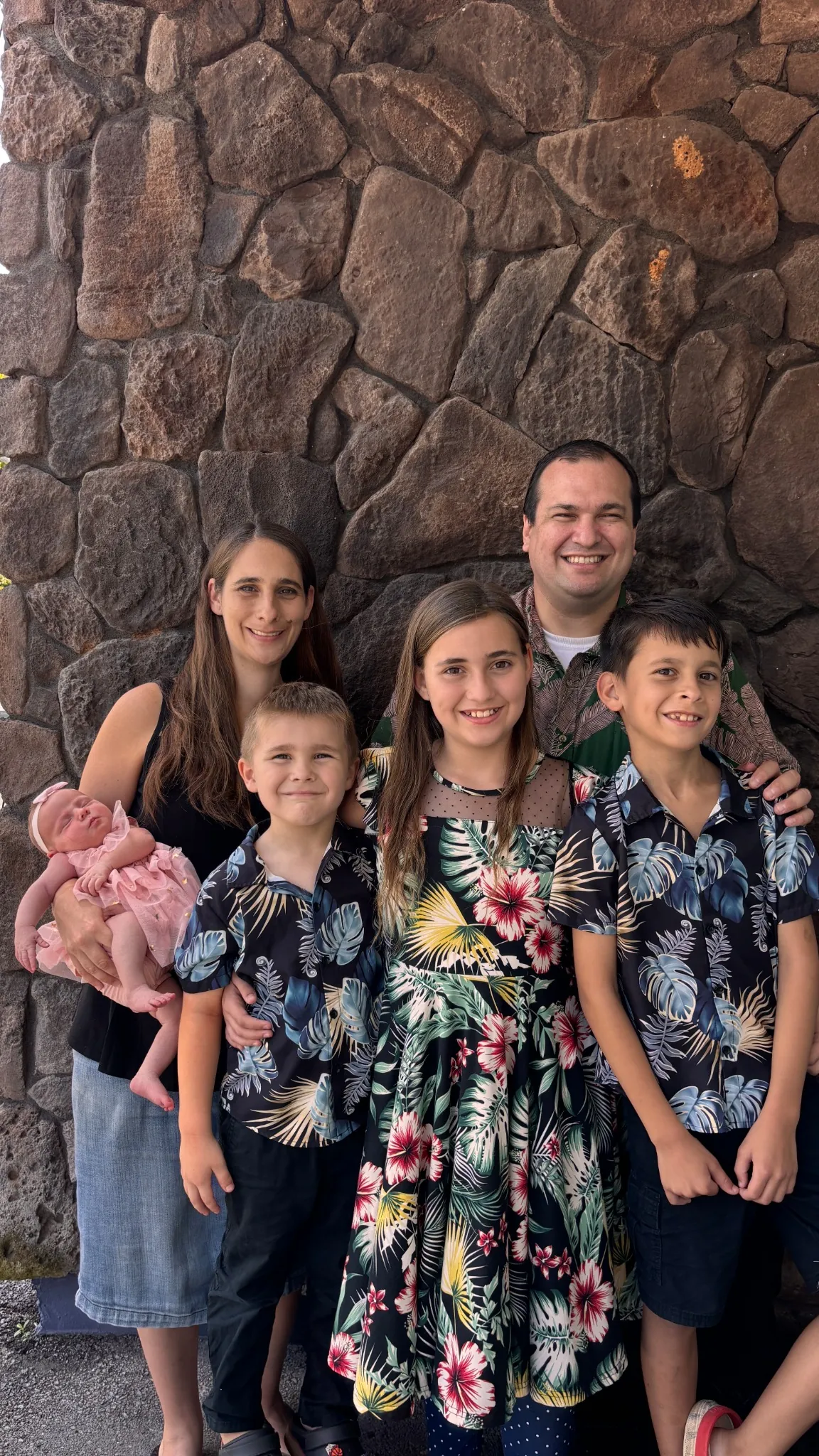 Pastor Travis Medeiros with his wife and children